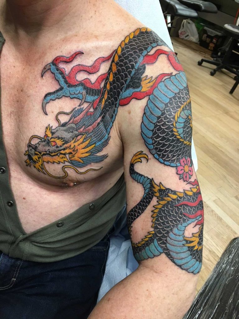 Dragon done  Rising Dragon in NYC Artist Darren Rosa Part of a koi  sleeve and hannya in progress on the rear shoulder  rirezumi
